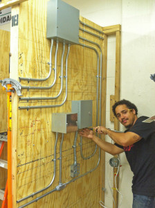 Gabriel learning at OACES before commercial electrical job.